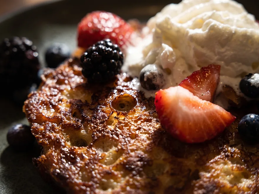 Croissant French toast with sweet cream custard, fresh berries, and whipped cream at Maisie’s Green Brae