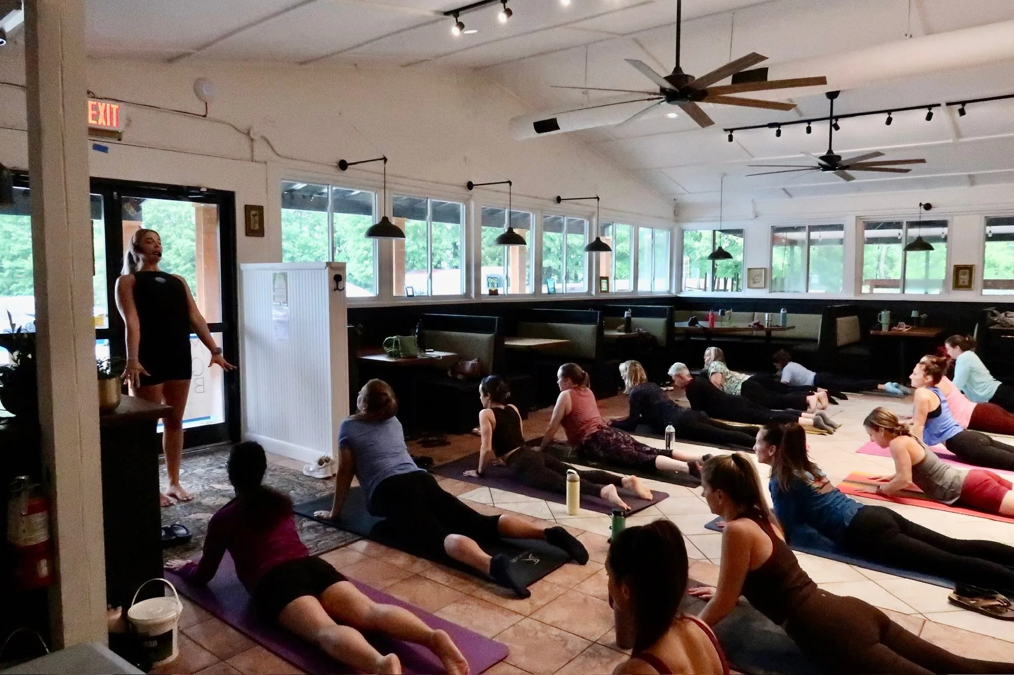 Thirty-three mats laid across the dining room floor for the Vibe Pilates class at Maisie's Green Brae